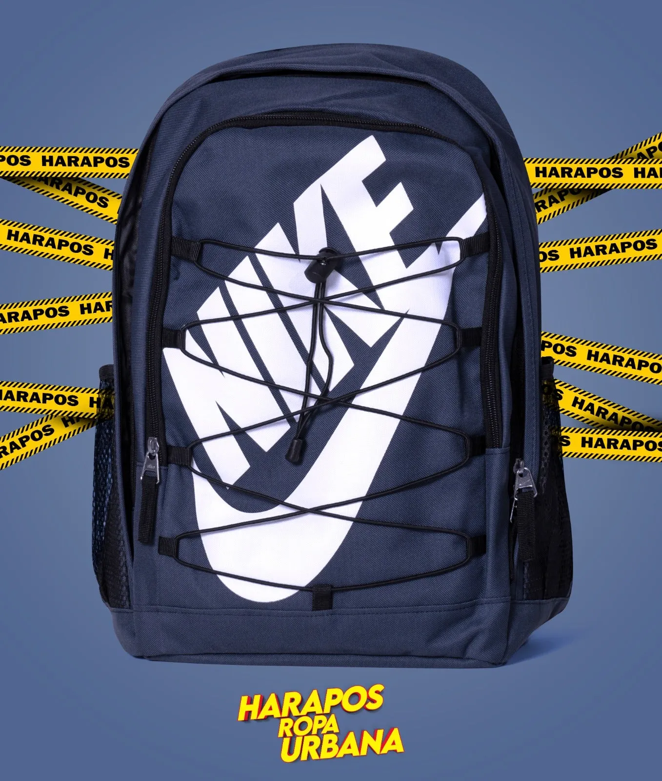 Nike backpack with dark blue crossed elastic and white letters.